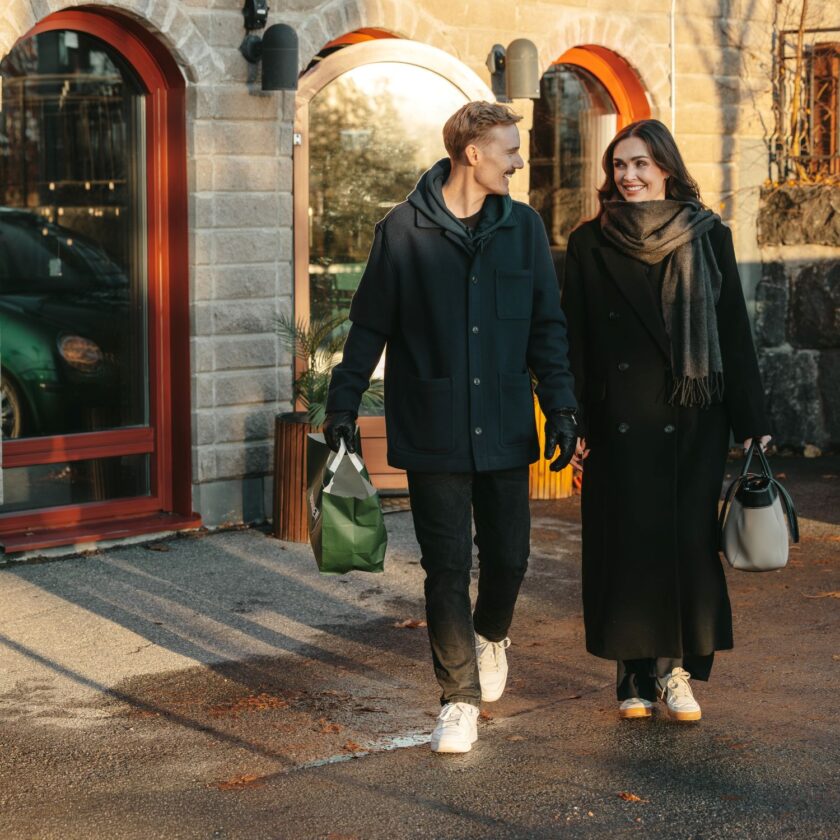 Nordlo women and man walking from retail store